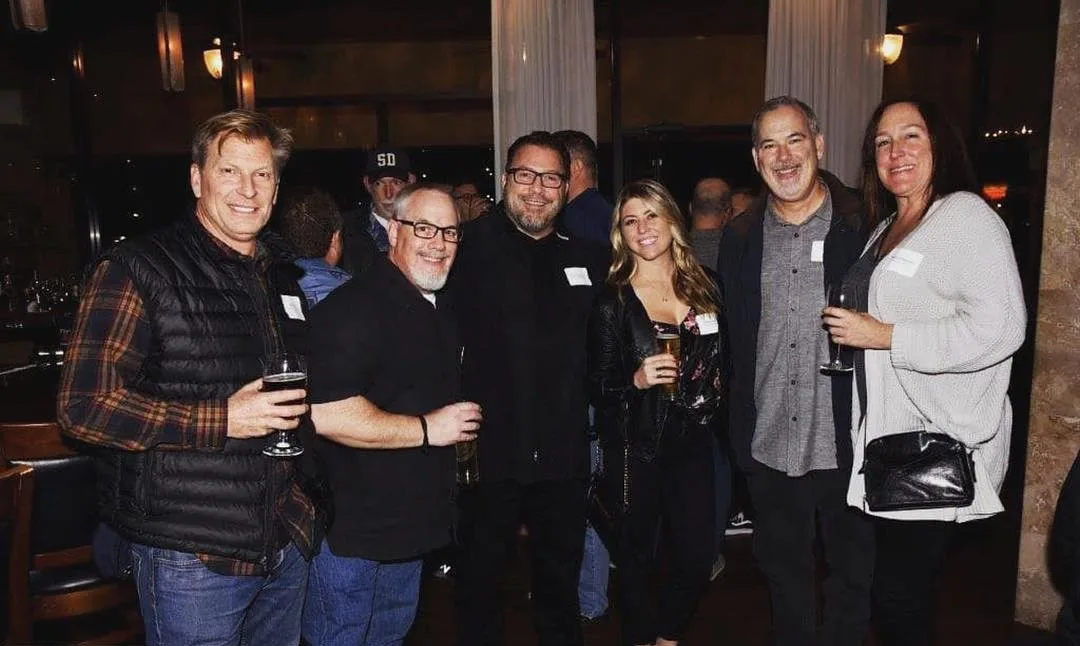 Group enjoying drinks at Vincenzo happy hour