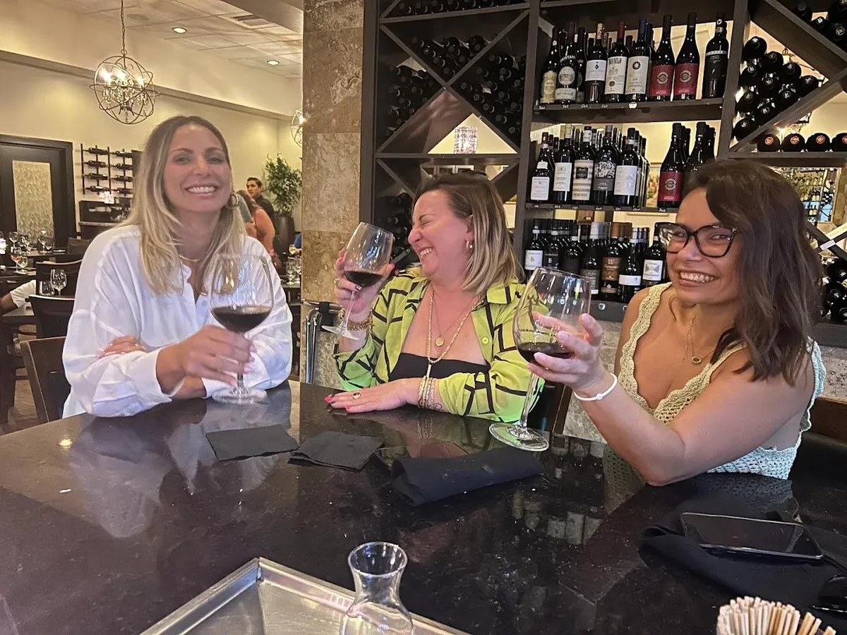 Women enjoying wine at Vincenzo bar