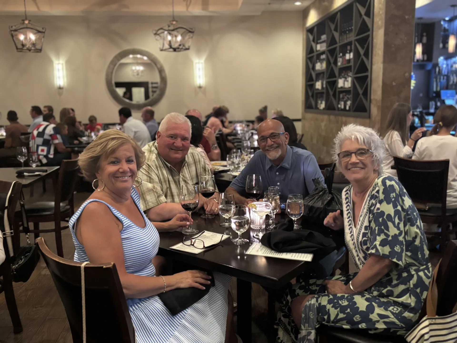 Couples enjoying wine casually at Vincenzo