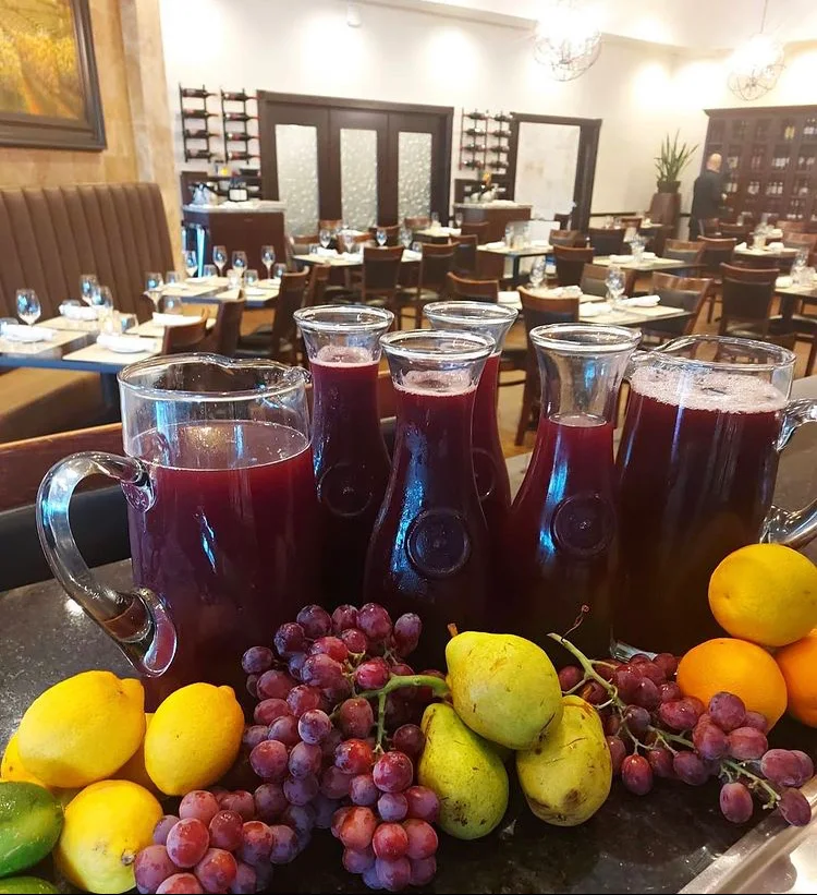 Sangria pitchers at Vincenzo happy hour bar scene Orlando