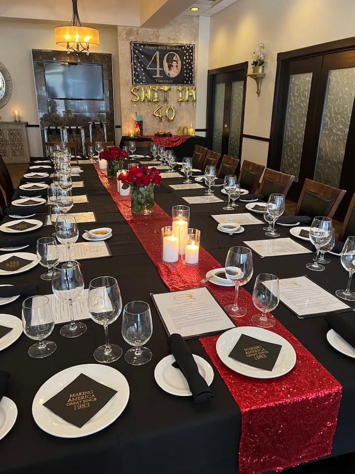 40th birthday table setup with red runner and candles at Vincenzo